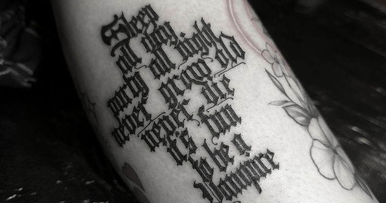 Blackletter script tattoo by SixtyInk