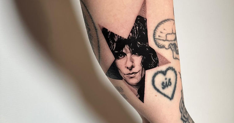 Portrait within a star tattoo from SixtyInk’s surrealism portfolio